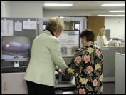 Woman being fingerprinted